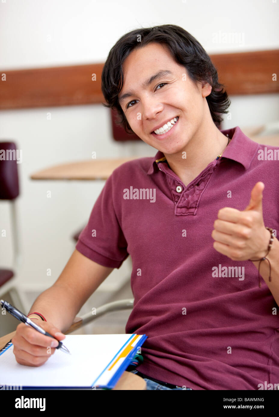 Thumbs up student Stock Photo - Alamy