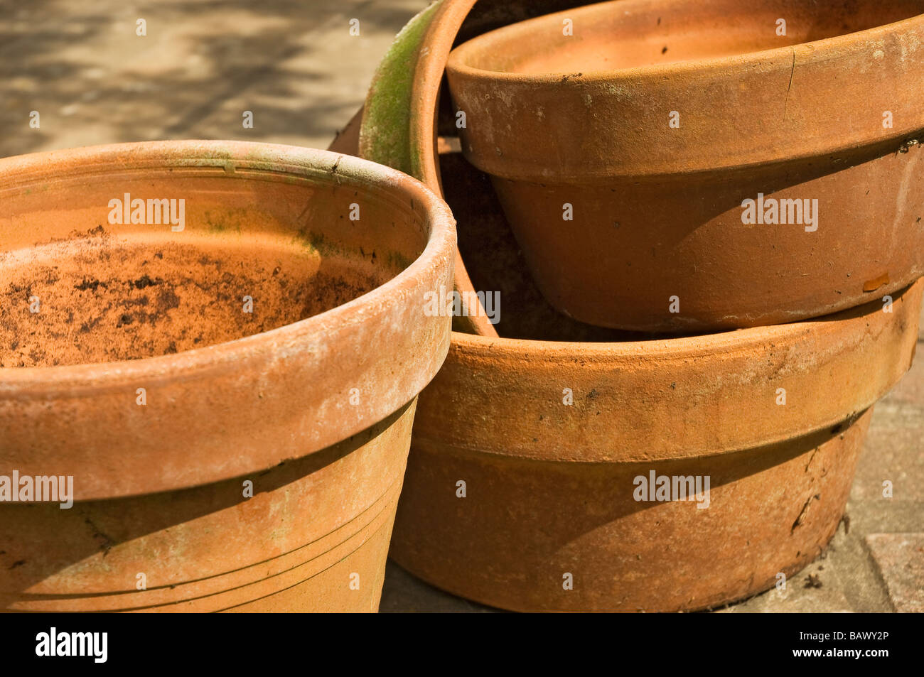 Stack of empty terracotta clay plant pots pot container containers Close up England UK United Kingdom GB Great Britain Stock Photo