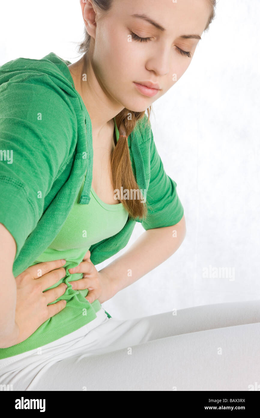 young woman with stomach ache Stock Photo