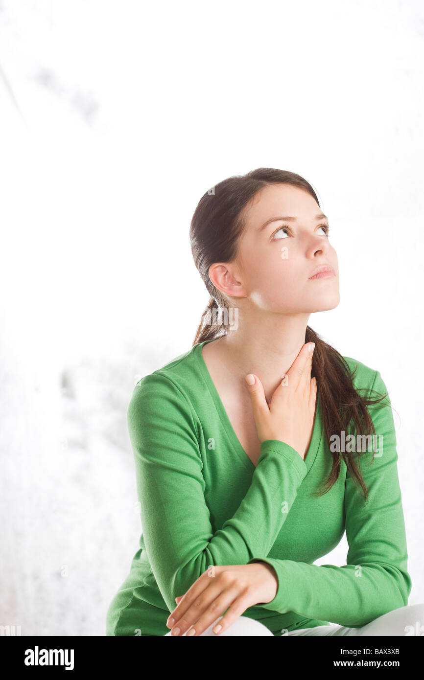 woman touching her neck Stock Photo Alamy