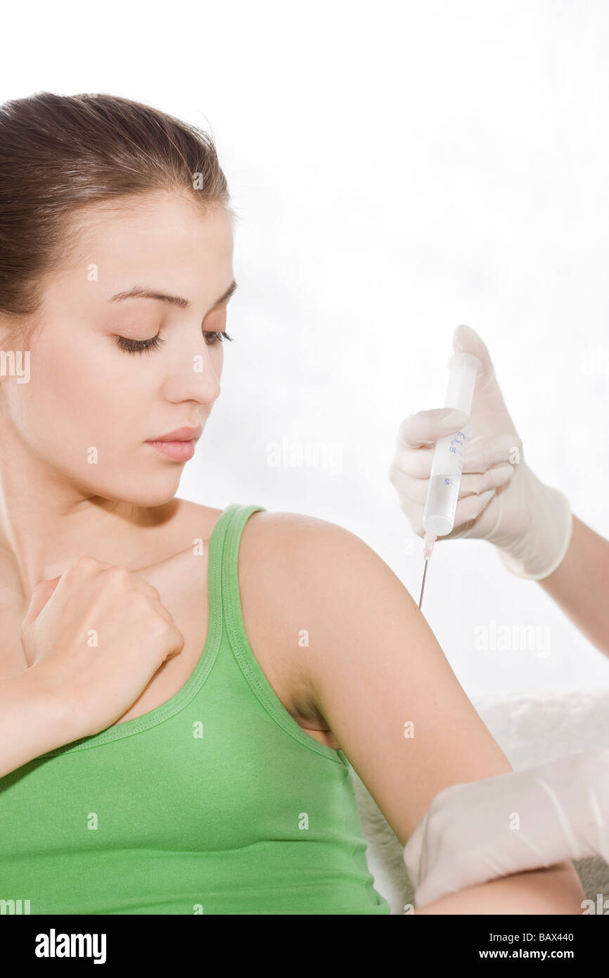 woman receiving vaccine Stock Photo