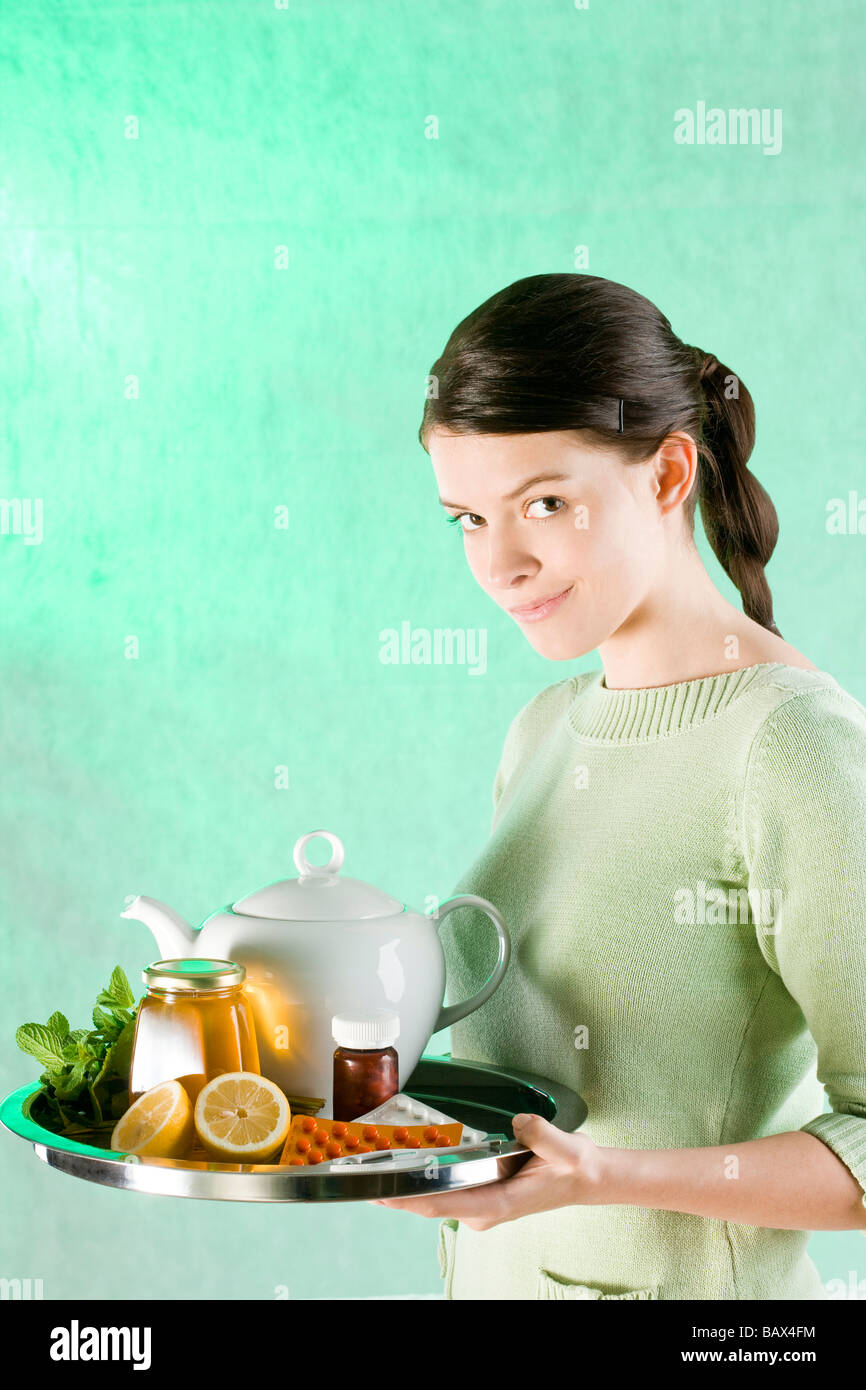 woman carrying tray with medicine Stock Photo