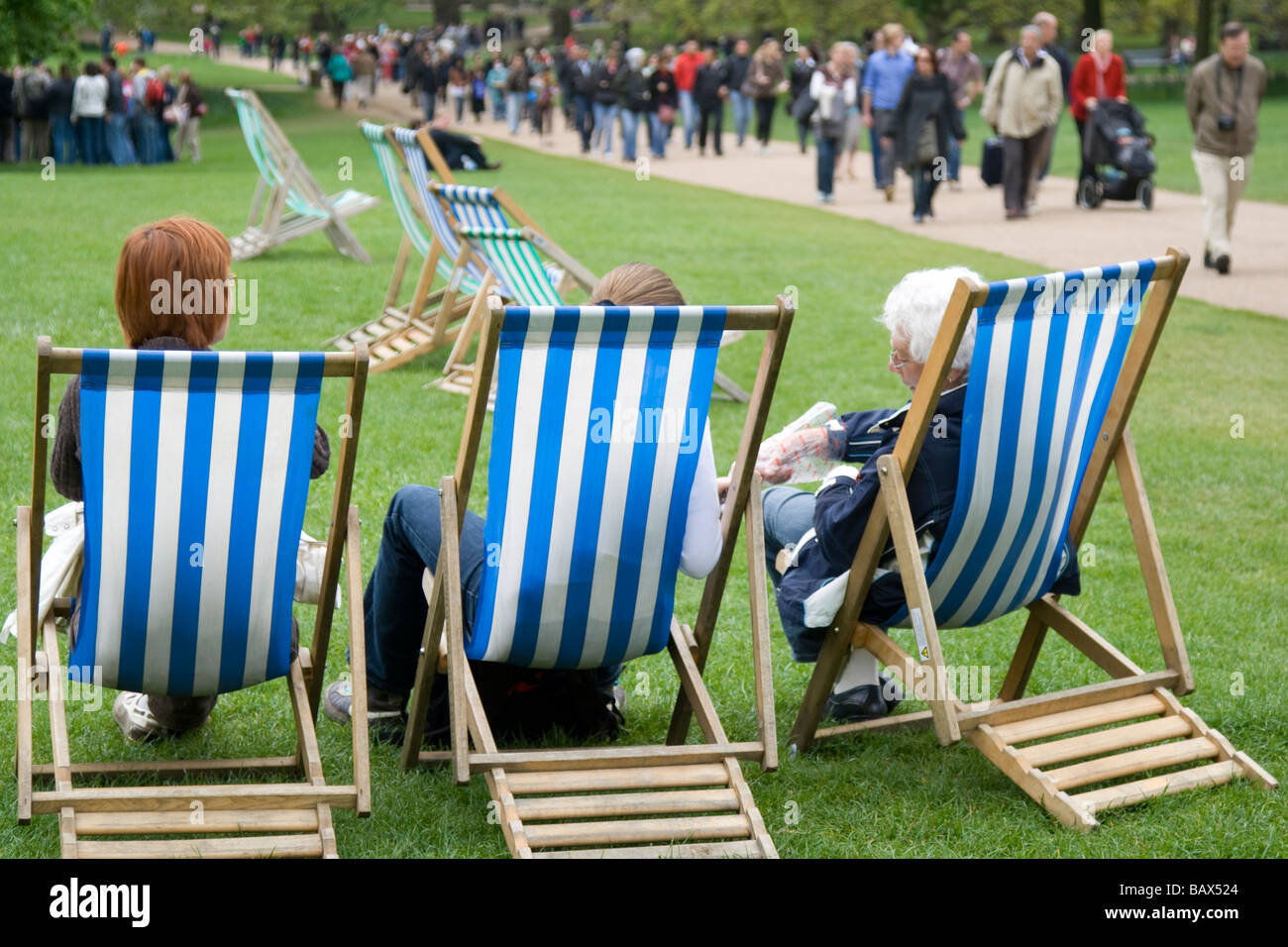 Women sitting in deckchairs in Green Park Stock Photo Alamy