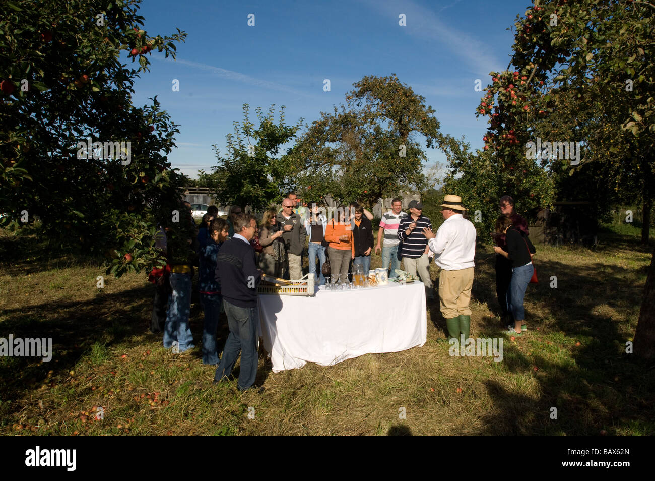 John Riddle conducts a public visit to a cider apple orchard of Riddles Cider Gloucestershire England Stock Photo