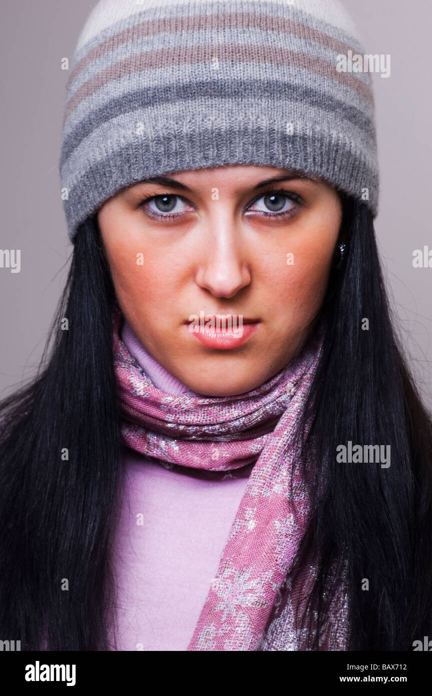 Young woman wearing a wool hat looking at the camera Stock Photo