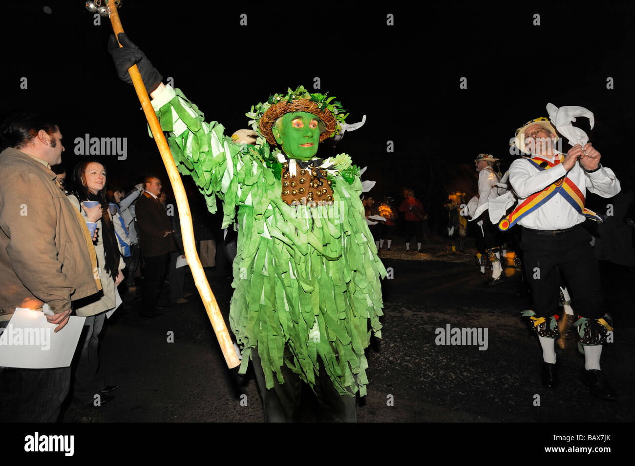 Green Man and Mendip Morris Men lead the Wassailing Procession during Thatchers Cider Wassailing event Stock Photo