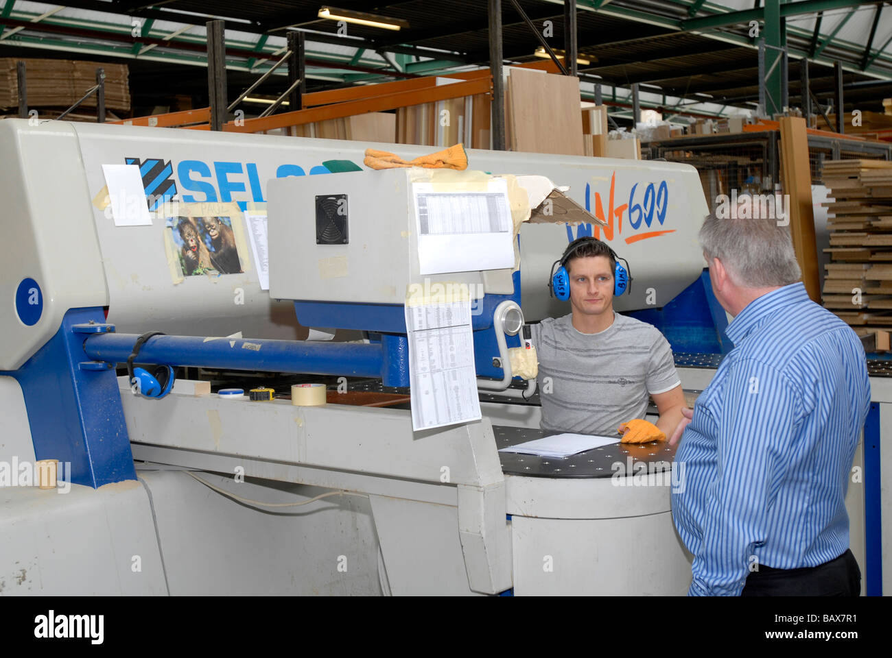 Wood being machined in a Kitchen factory Stock Photo