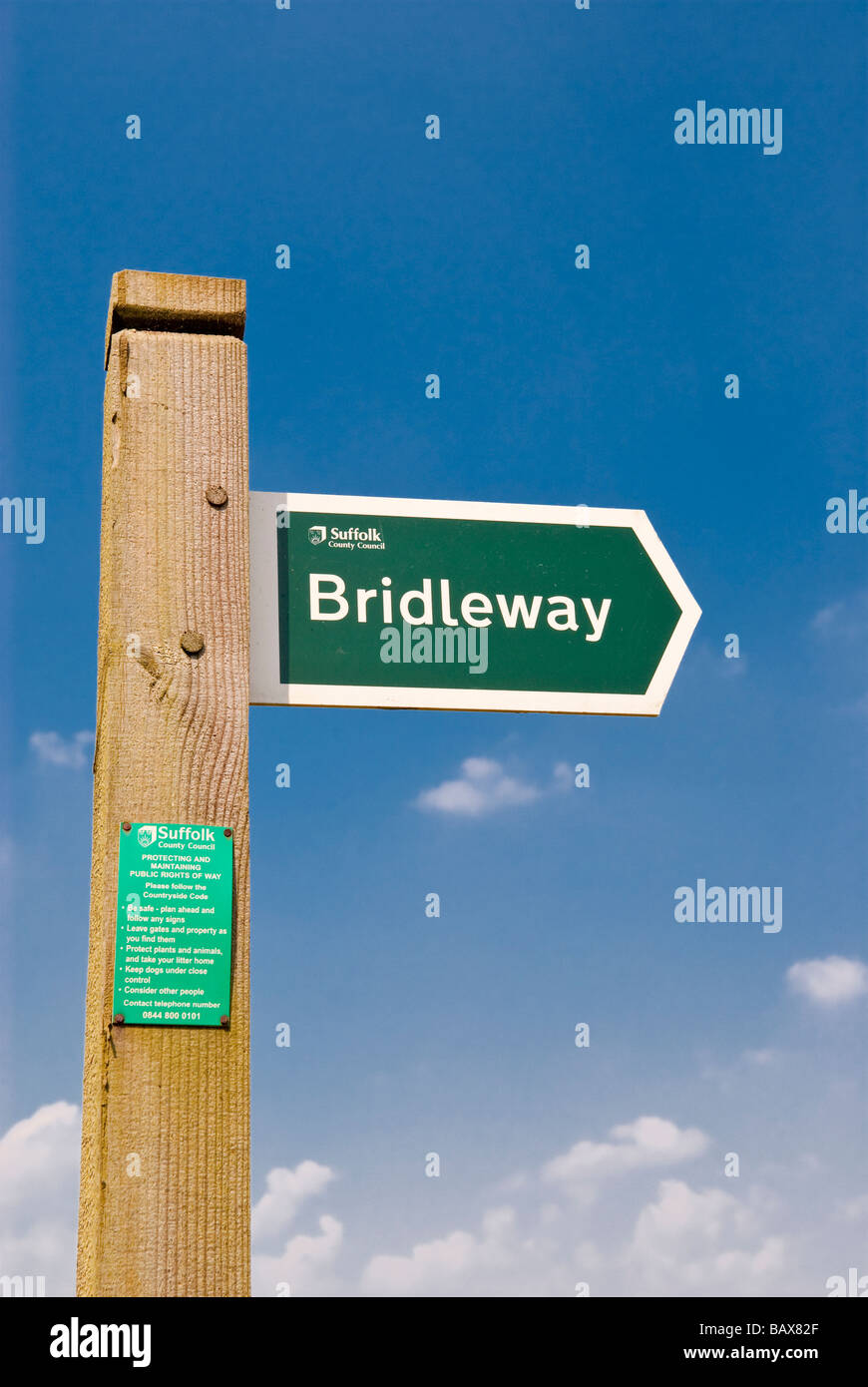 A sign in the Suffolk uk countryside pointing towards the bridleway (public right of way). Stock Photo