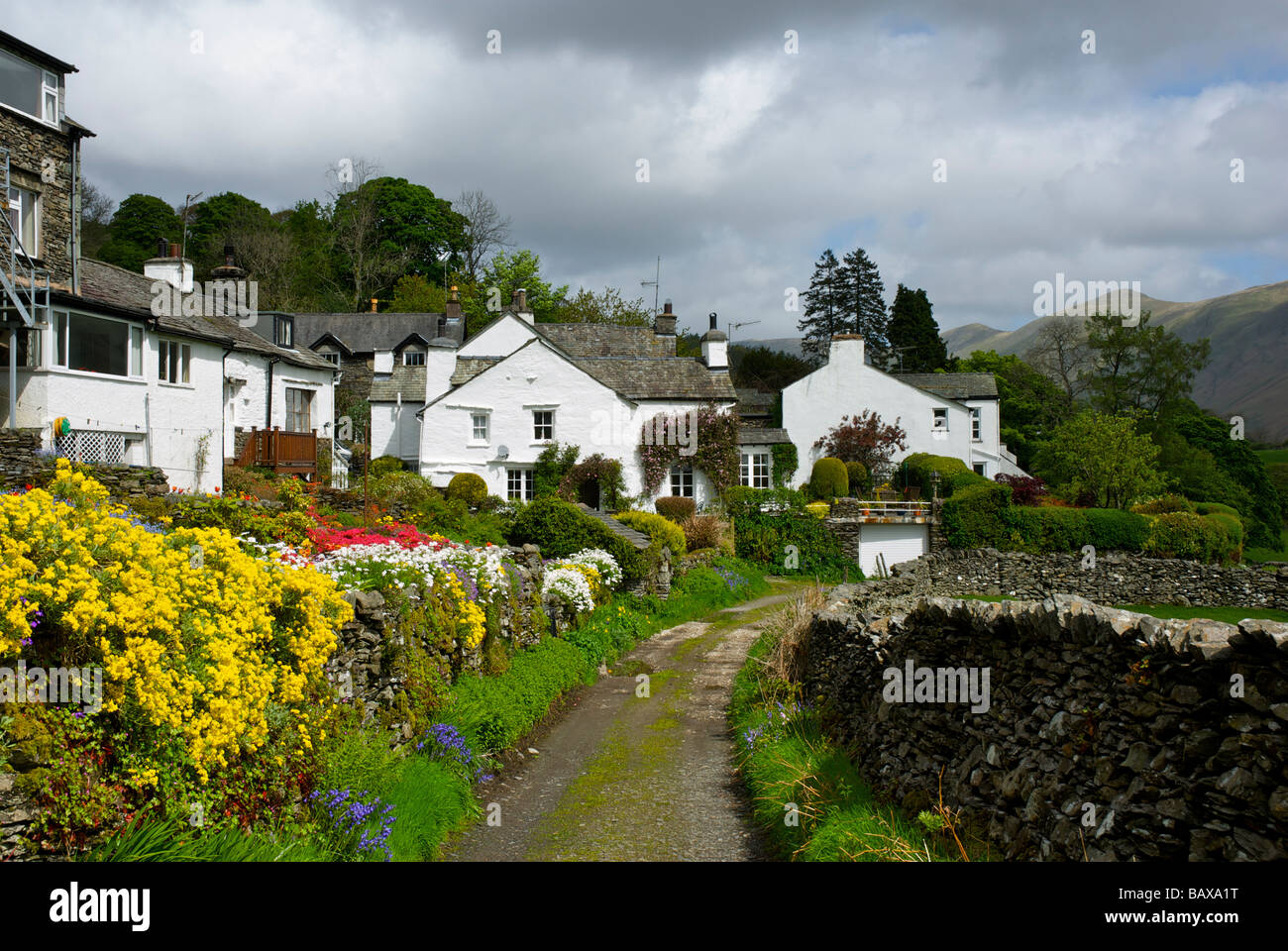 Narrow lane and houses in the village of Troutbeck, near Ambleside, Lake District National Park, Cumbria, England UK Stock Photo
