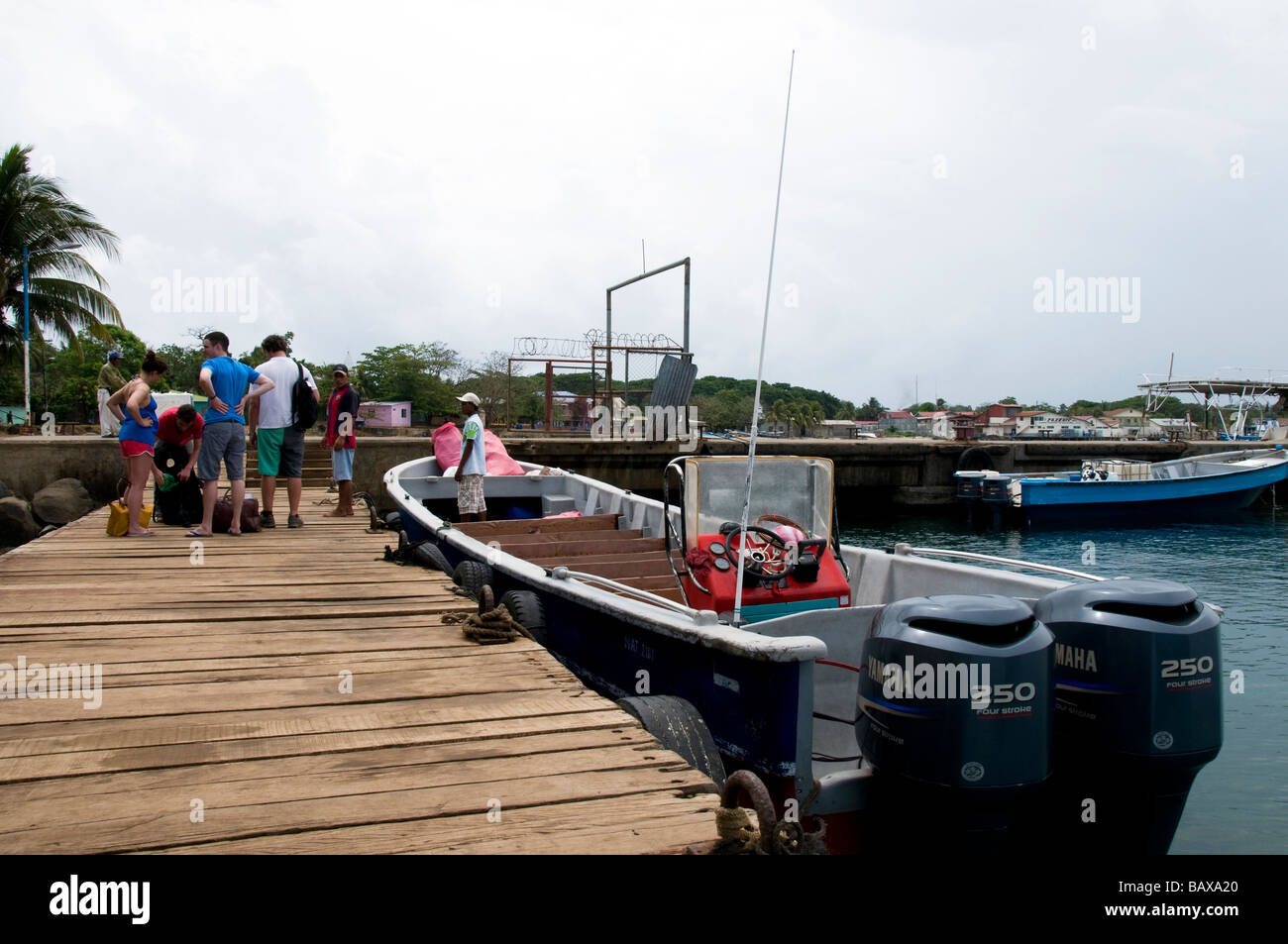Tourists wait to board the panga commuter boat at Brig Bay, Big Corn