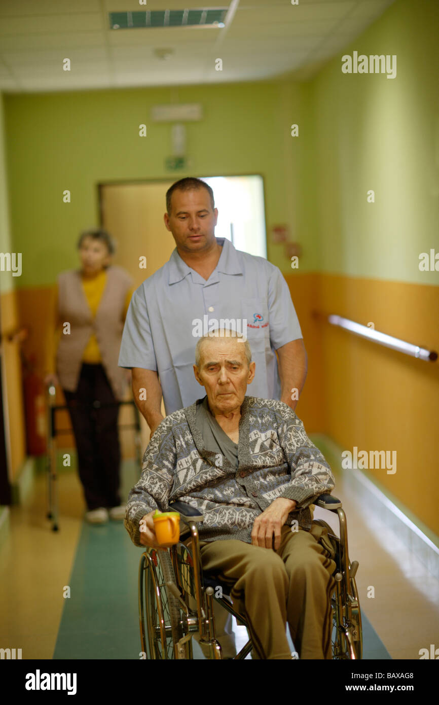 Nursing home elderly man with a man nurse Stock Photo