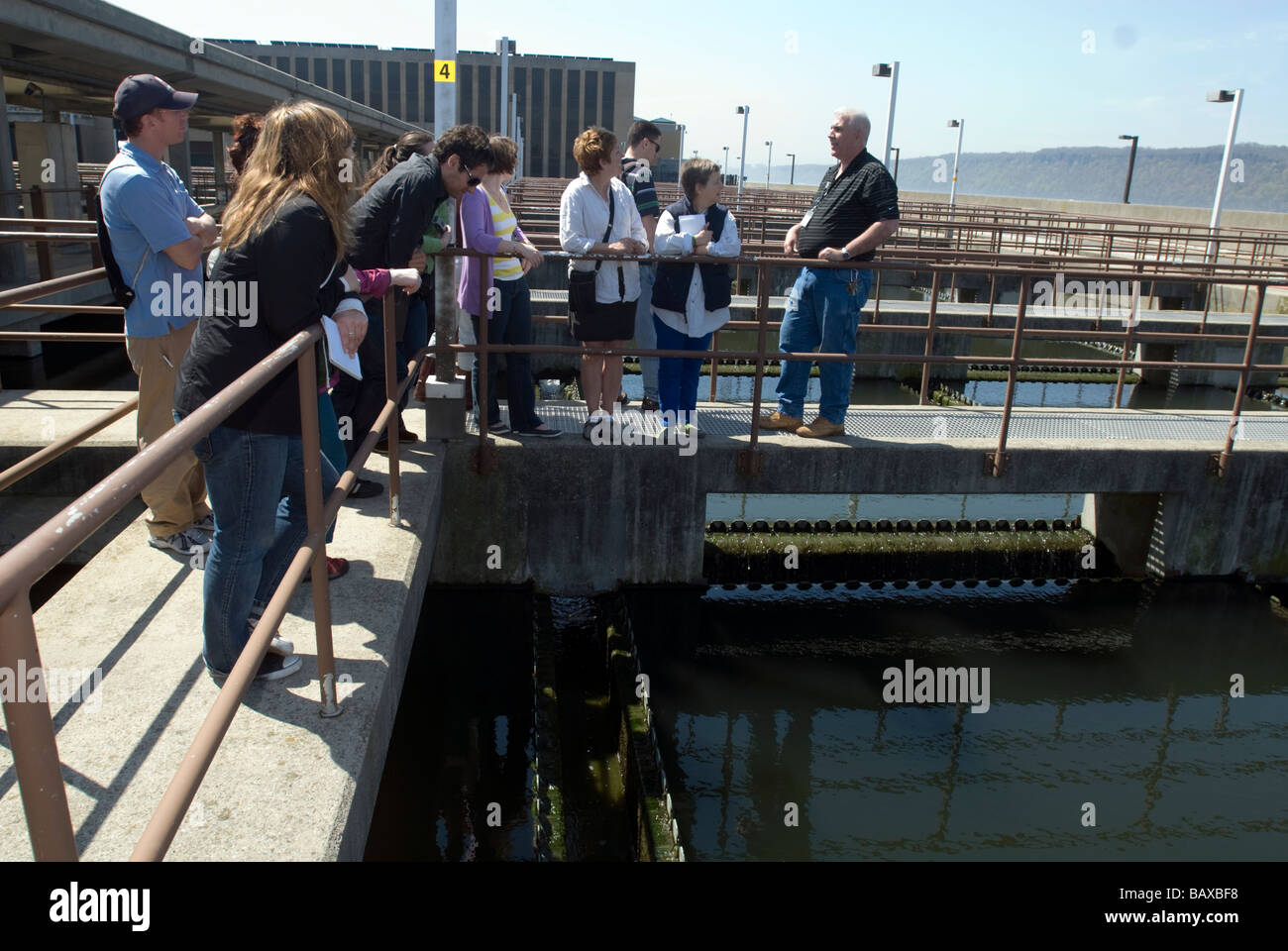 A tour group listens to the plant manager describe the treatment