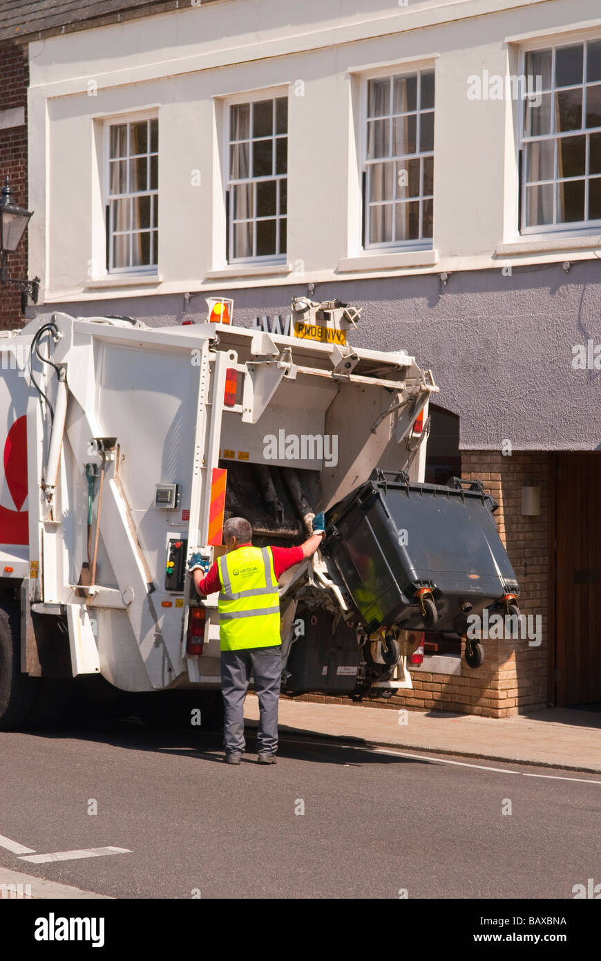 A Veolia environmental services lorry vehicle for industrial waste disposal in the Uk eptying large wheely bins Stock Photo