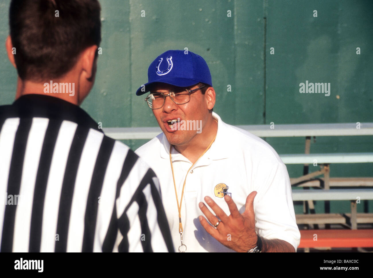 Angry man coach father official ref disagree argue emotion mad Hispanic