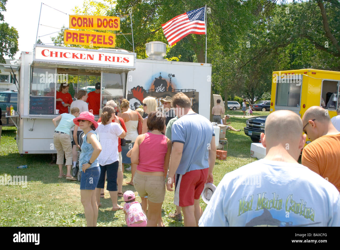 People in line to get food at corn dog and chicken fries concession