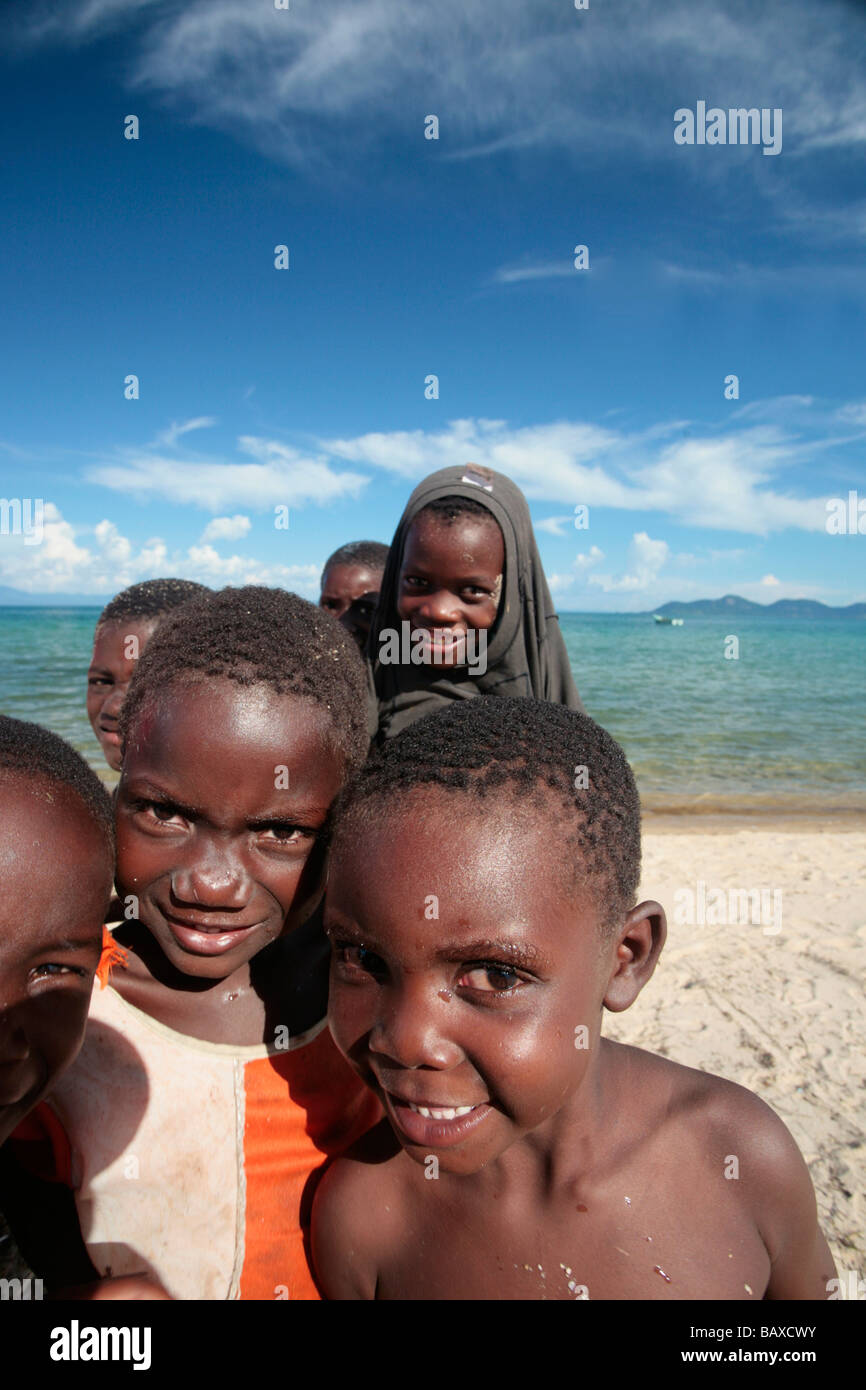 Children having fun on the shore of Lake Malawi at Monkey Bay in Malawi Stock Photo