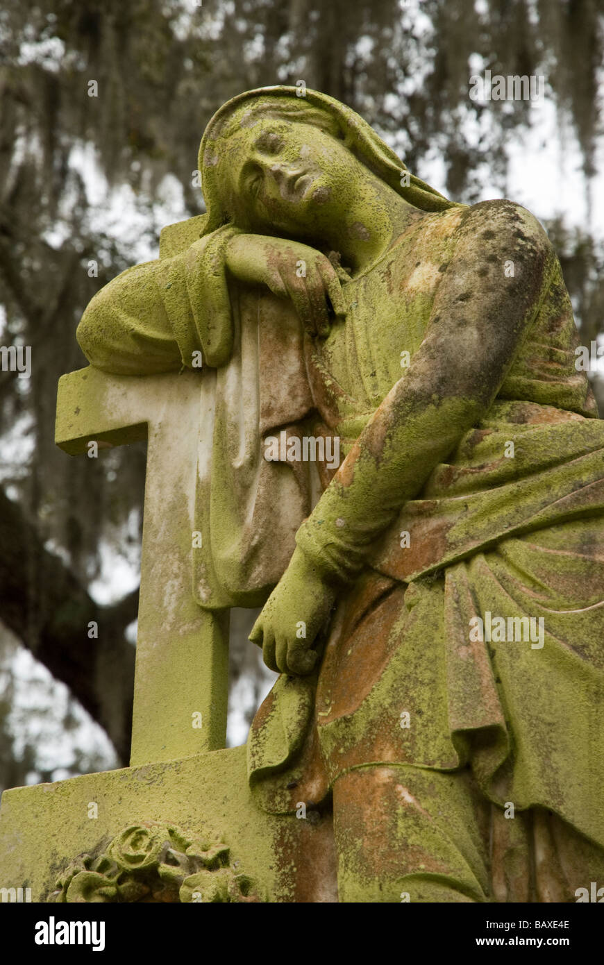 Moss covered statue in Bonaventure Cemetery in Savannah Georgia Stock Photo