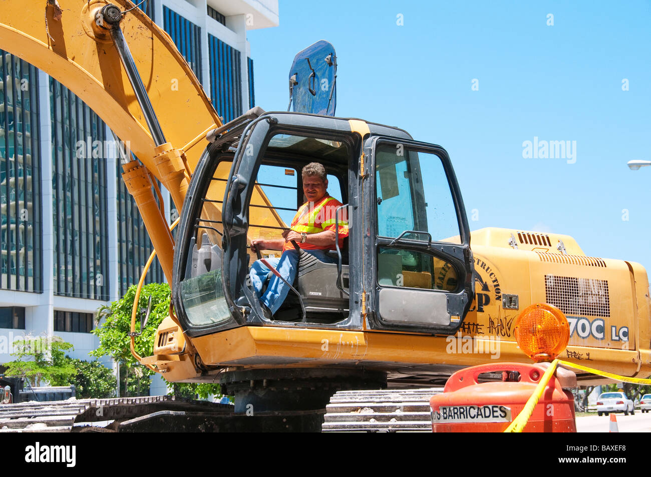 Man in excavator cab Stock Photo
