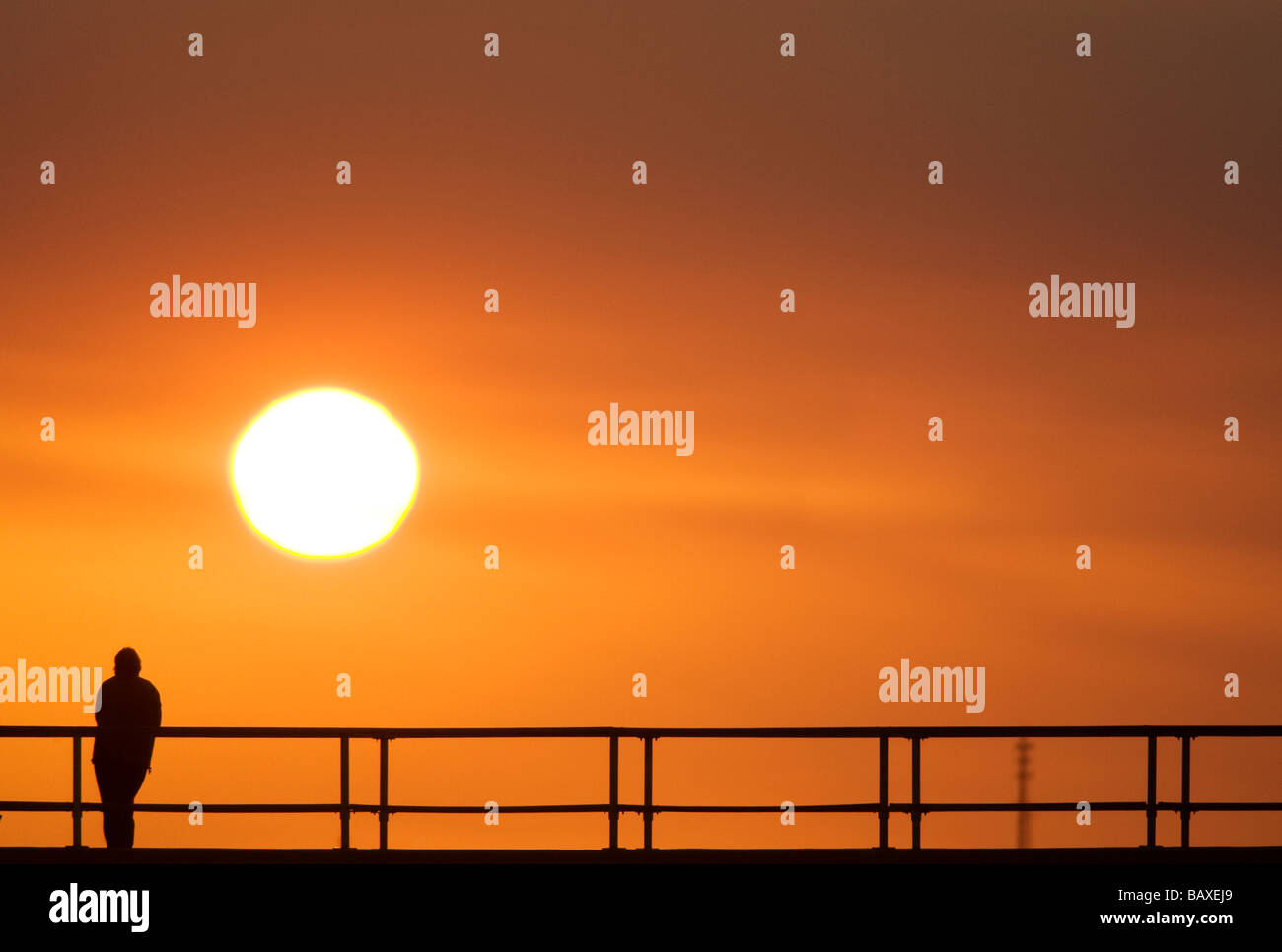 Person watching sunset hi-res stock photography and images - Alamy