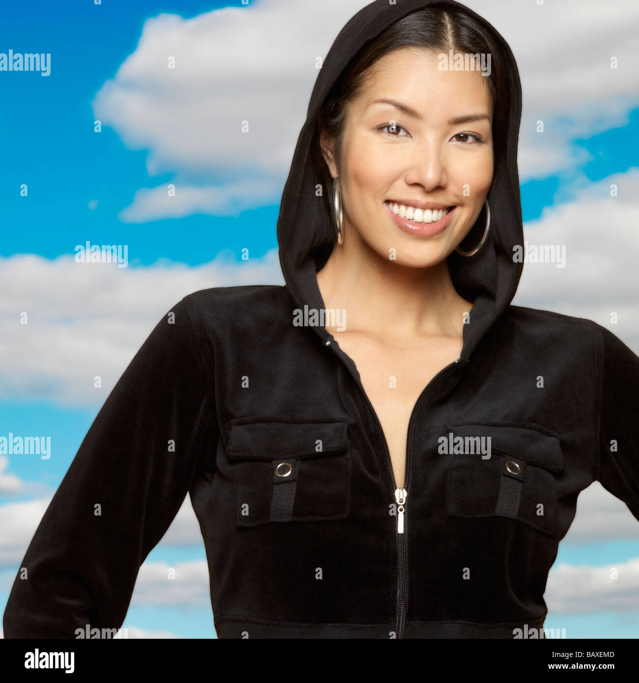 Portrait of Asian woman wearing hooded sweatshirt Stock Photo