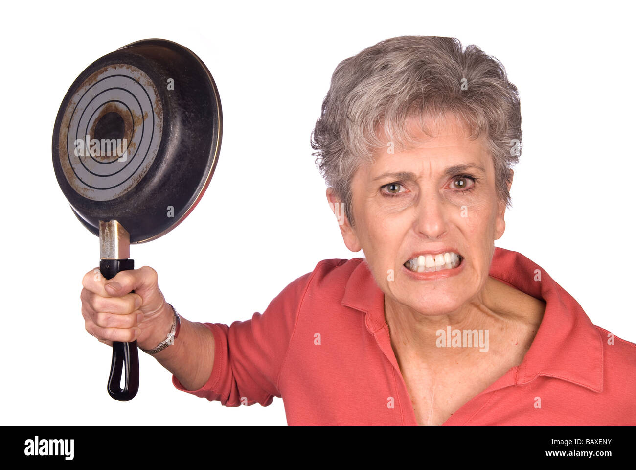 A mother gets ready to swing her frying pan in anger Stock Photo Alamy