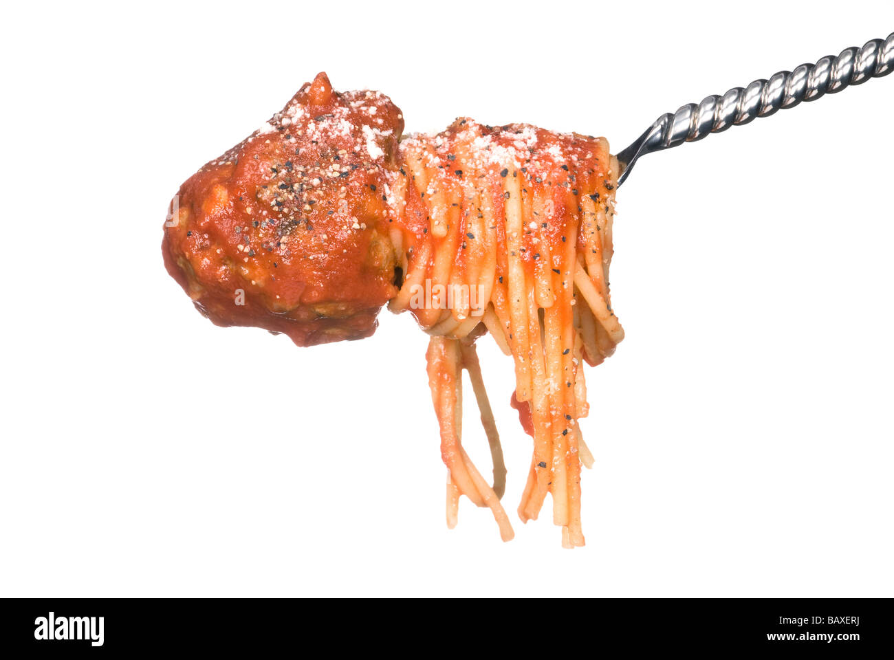 A fork with rolled spaghetti noodles and a delicious meatball ready to be consumed Stock Photo