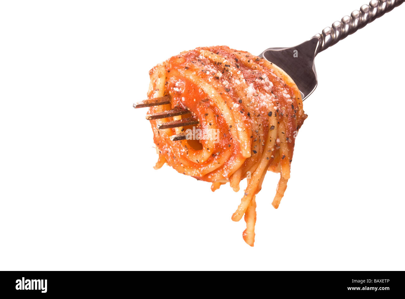 A fork with Spaghetti pasta wrapped around it and isolated on a white background Stock Photo