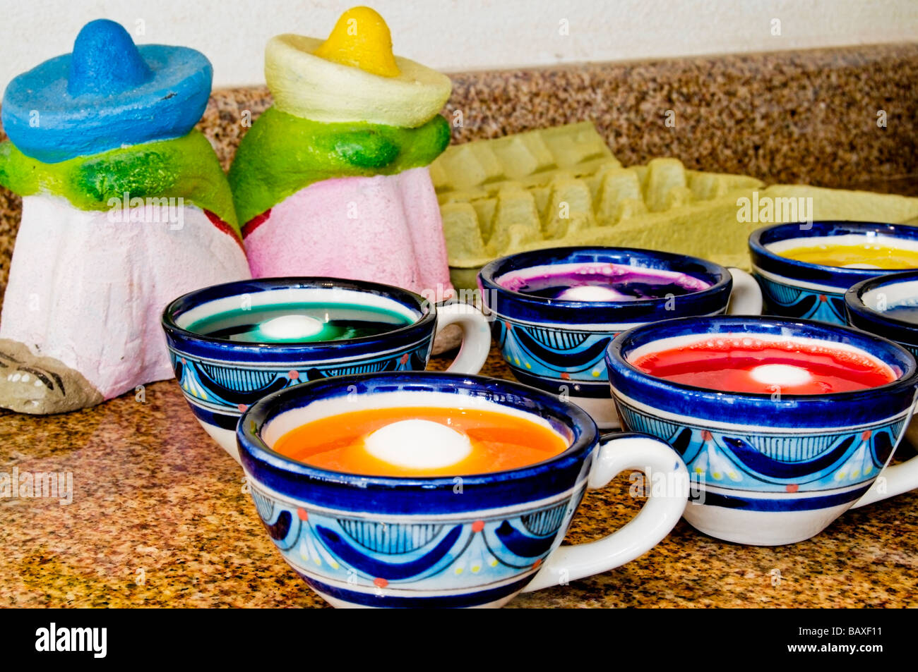 Easter eggs being dyed in a Mexican kitchen Stock Photo Alamy