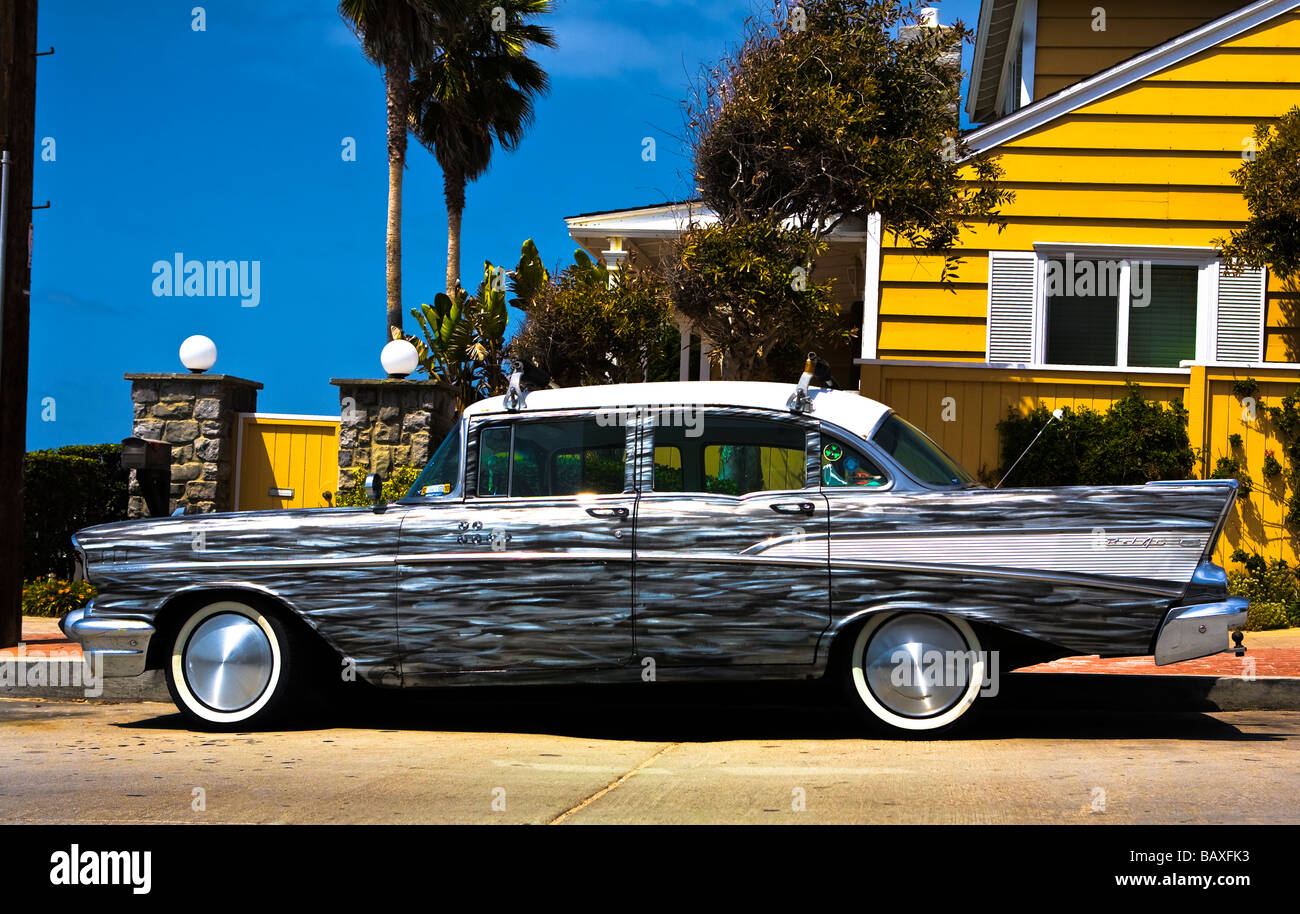 Hot rod car in San Diego outside yellow house. Stock Photo