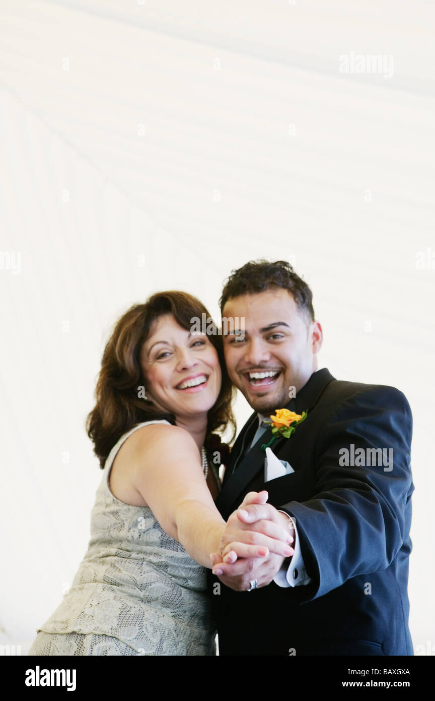 Groom dancing with mother at wedding Stock Photo