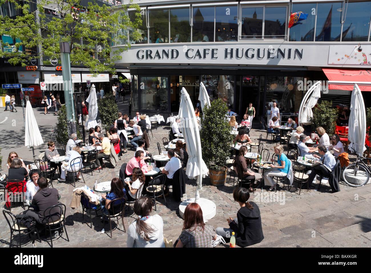 People sitting in a pavement cafe, Cafe Huguenin, Barfuesserplatz, Basel, Switzerland Stock Photo