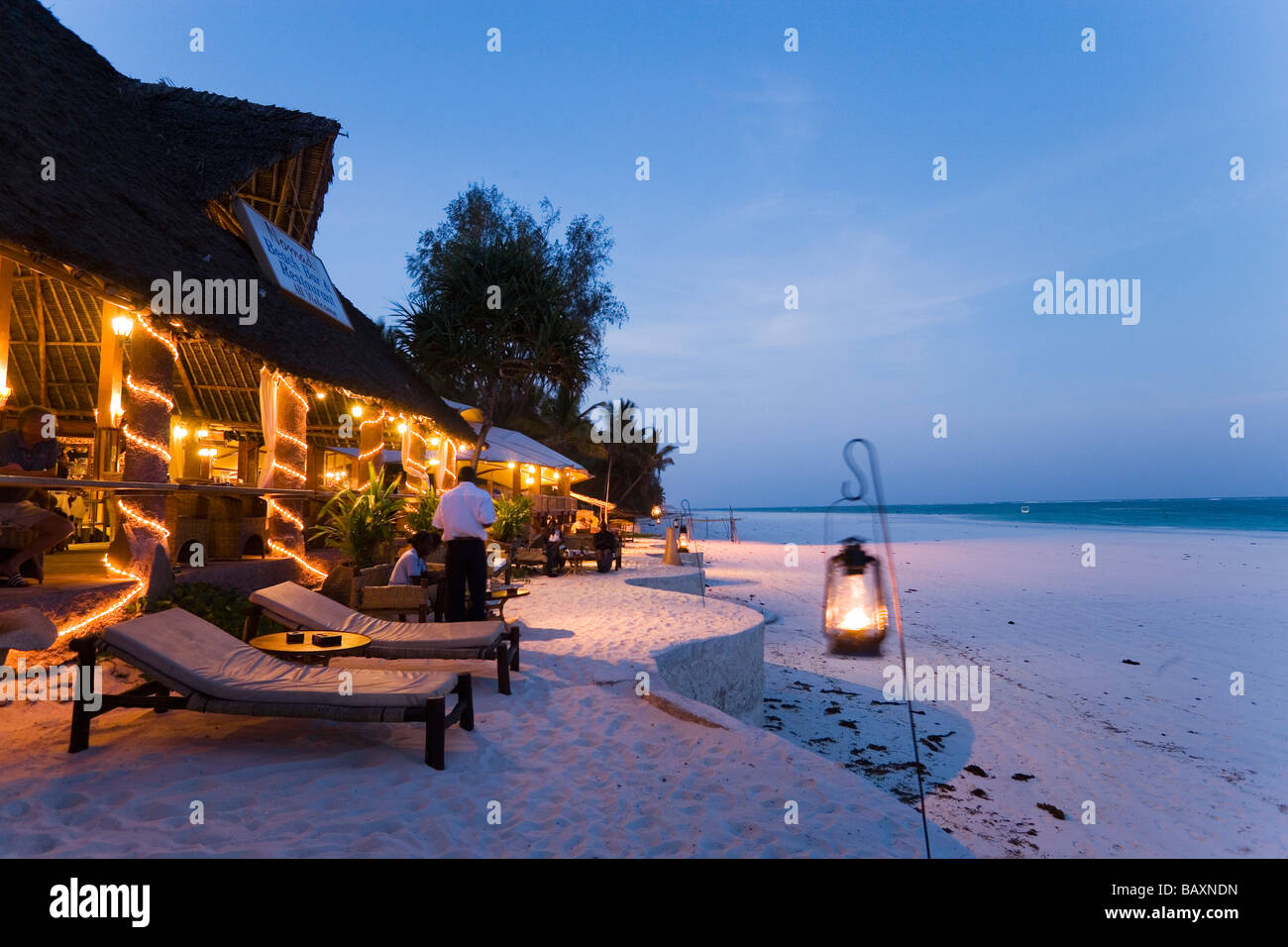 Sunlougers and beach bar in the evening, The Sands, at Nomad, Diani Beach, Kenya Stock Photo