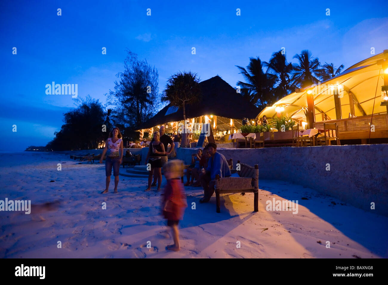 Guests attending a beach party in a beach restaurant, The Sands, at Nomad, Diani Beach, Kenya Stock Photo