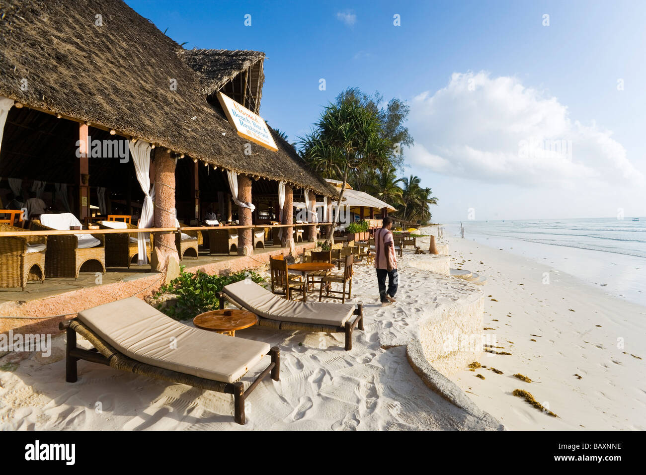 Beach restaurant with sunloungers at beach, The Sands, at Nomad, Diani Beach, Kenya Stock Photo