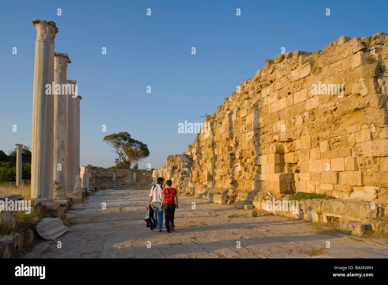 Tourists visiting the Antique Gymnasium, Palaestra, with columned courtyard, Archaeology, Salamis ruins, Salamis, North Cyprus, Stock Photo