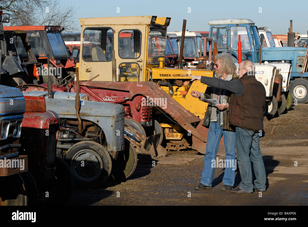 Discussions at a tractor auction UK Stock Photo Alamy