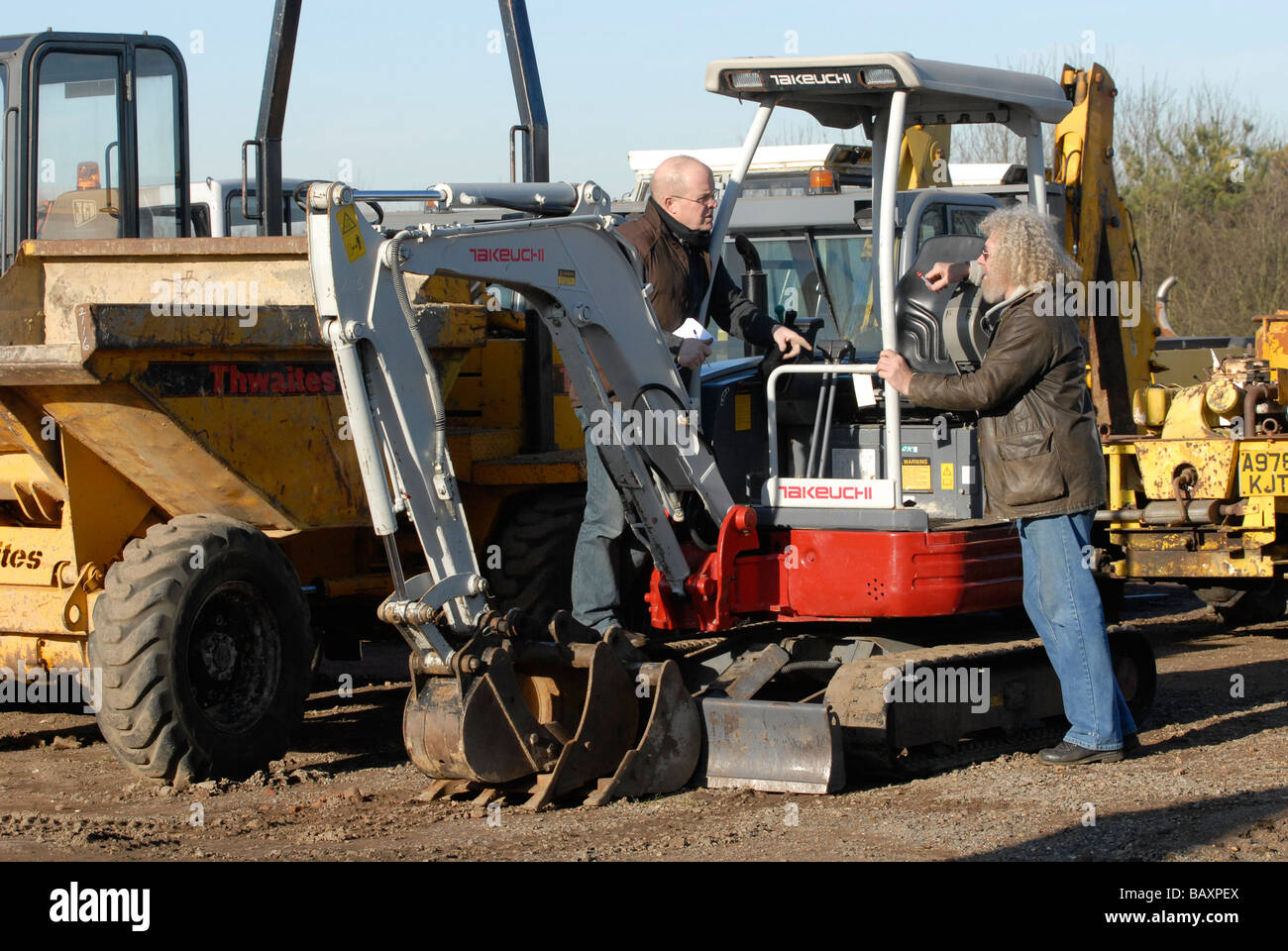 Discussions at a tractor auction UK Stock Photo