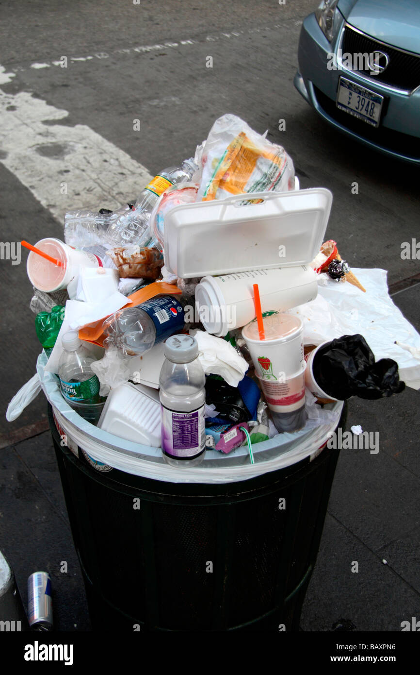 A bin full of rubbish on a street in New York Stock Photo Alamy