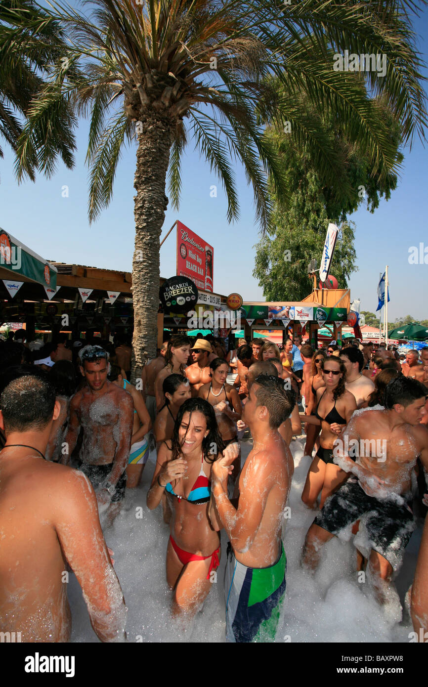 A Group Of Young People Dancing At A Foam Party Beach Party Nissi 