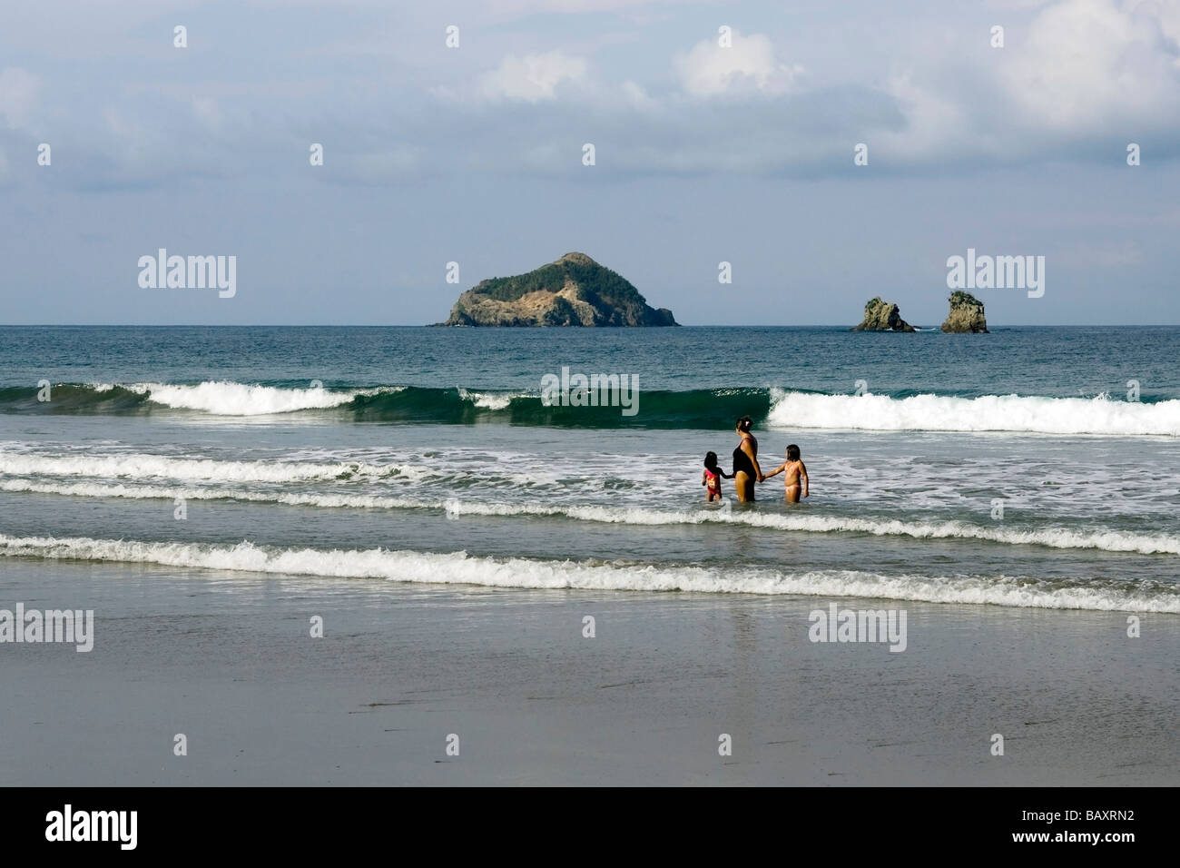 Mother and children in the surf Quepos, Costa Rica Stock Photo Alamy