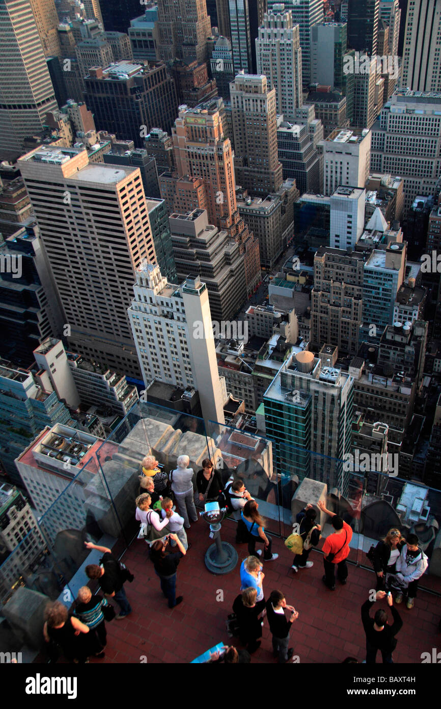 Tourists on the Top of the Rock observatory, Rockefeller Center, New York with New York City below. Stock Photo