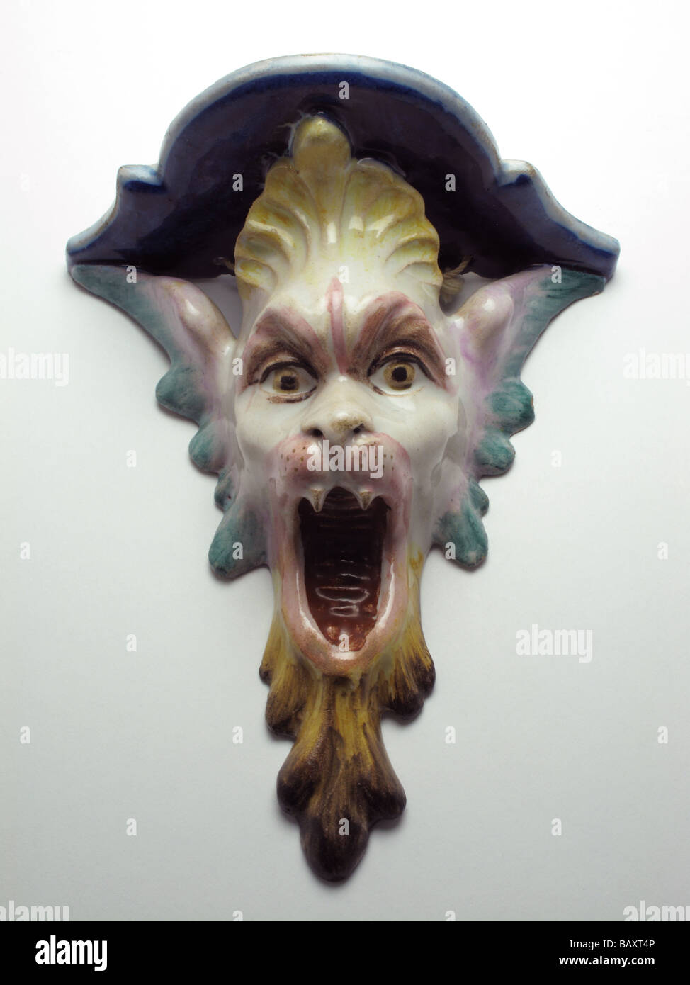 Antique Italian faience pottery wall bracket with grotesque mask circa 1890 Stock Photo