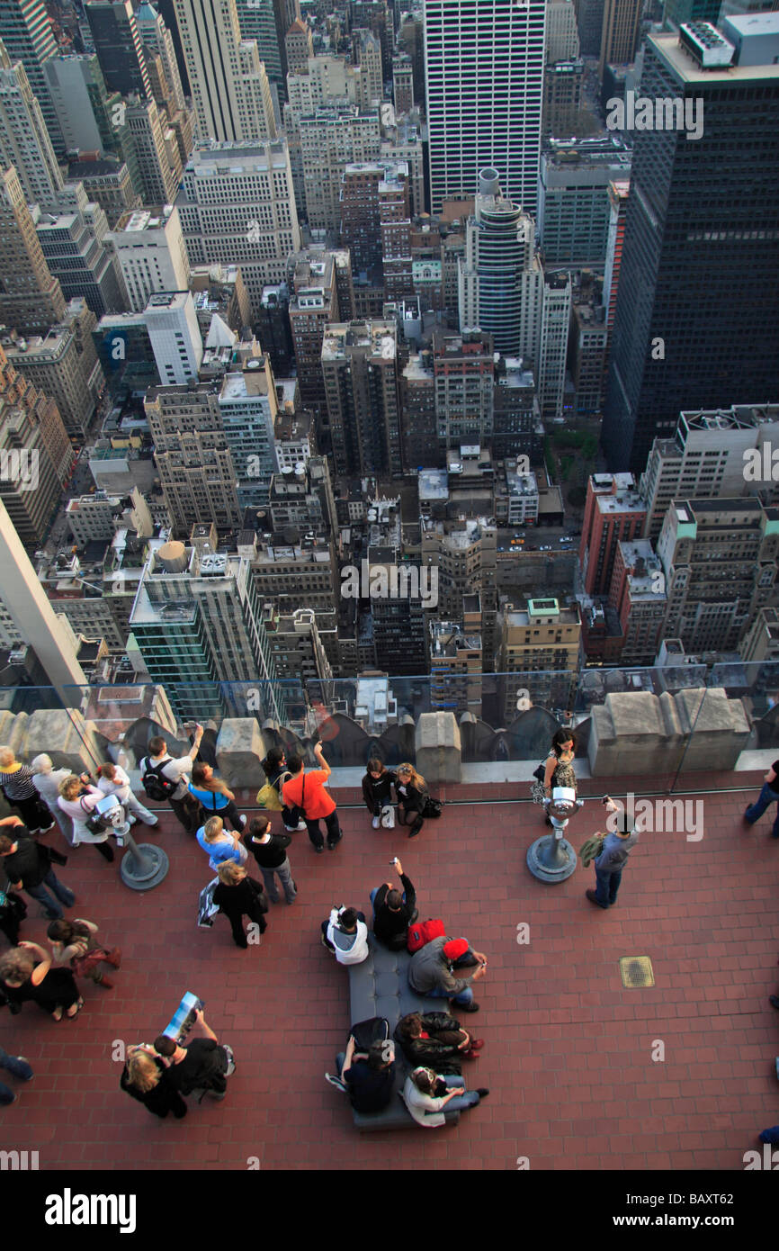 Tourists on the Top of the Rock observatory, Rockefeller Center, New York with New York City below. Stock Photo