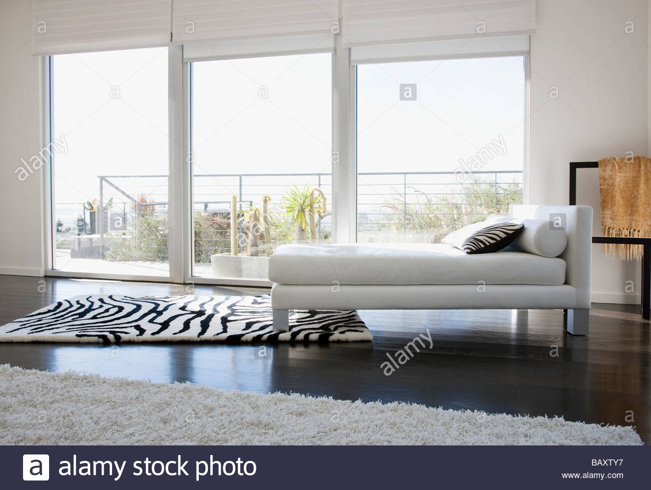 Interior of modern living room with glass walls stock image