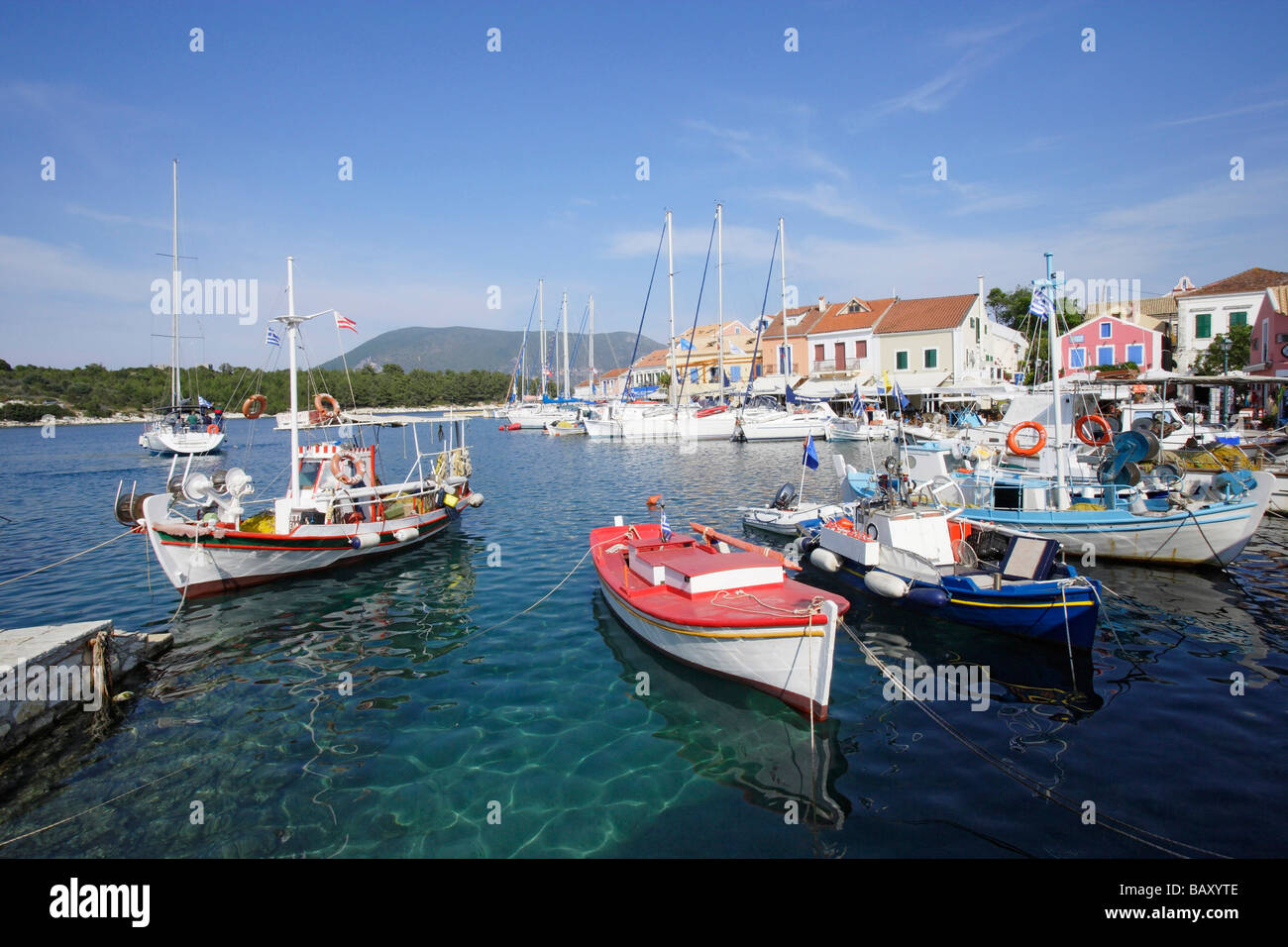 Boats moored in Fiskardo harbour, Cephalonia Island, Ionian Islands, Greece Stock Photo