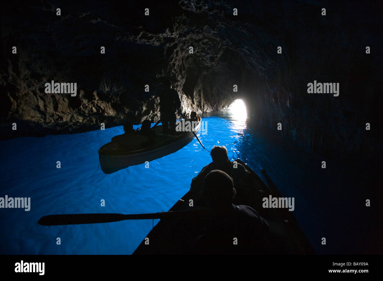 Rowing boats inside the Blue Grotto, Capri, Campania, Italy Stock Photo