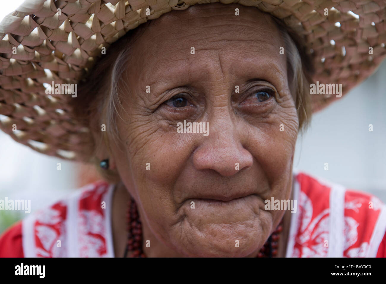 Friendly Polynesian Woman with hat, Fakarava, The Tuamotus, French Polynesia Stock Photo