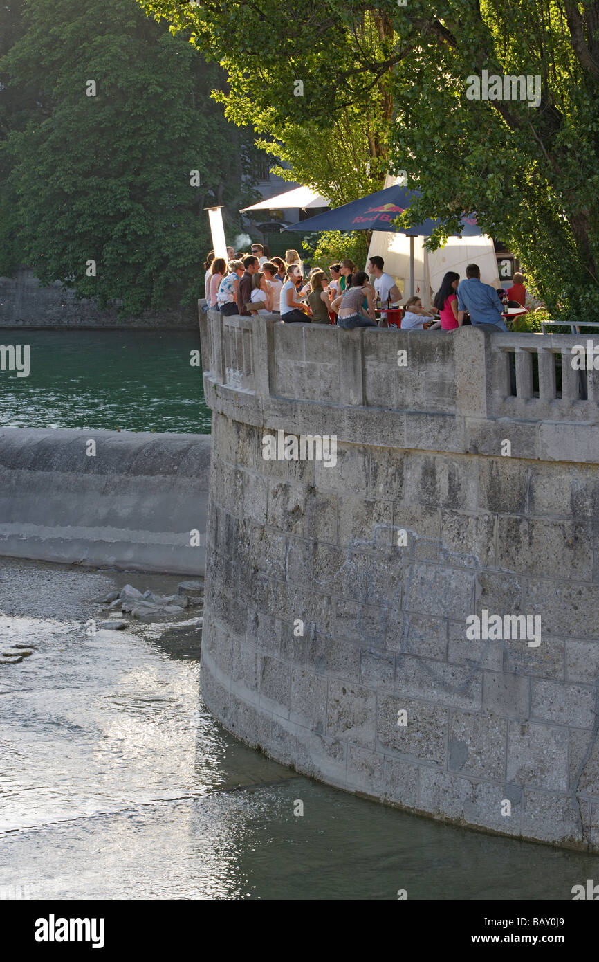 People enjoying themselves at a beach bar at the Museumsinsel, Munich, Bavaria, Germany Stock Photo
