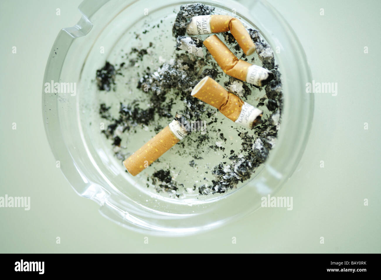 Cigarette butts in an ash tray, Close-up Stock Photo