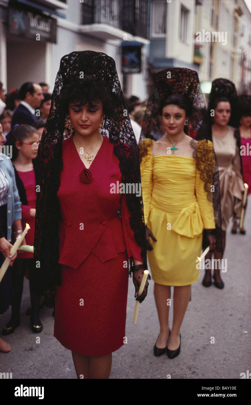 Young women wearing black lace mantillas in a procession during a festival, Lucena, Cordoba province, Andalusia, Spain Stock Photo